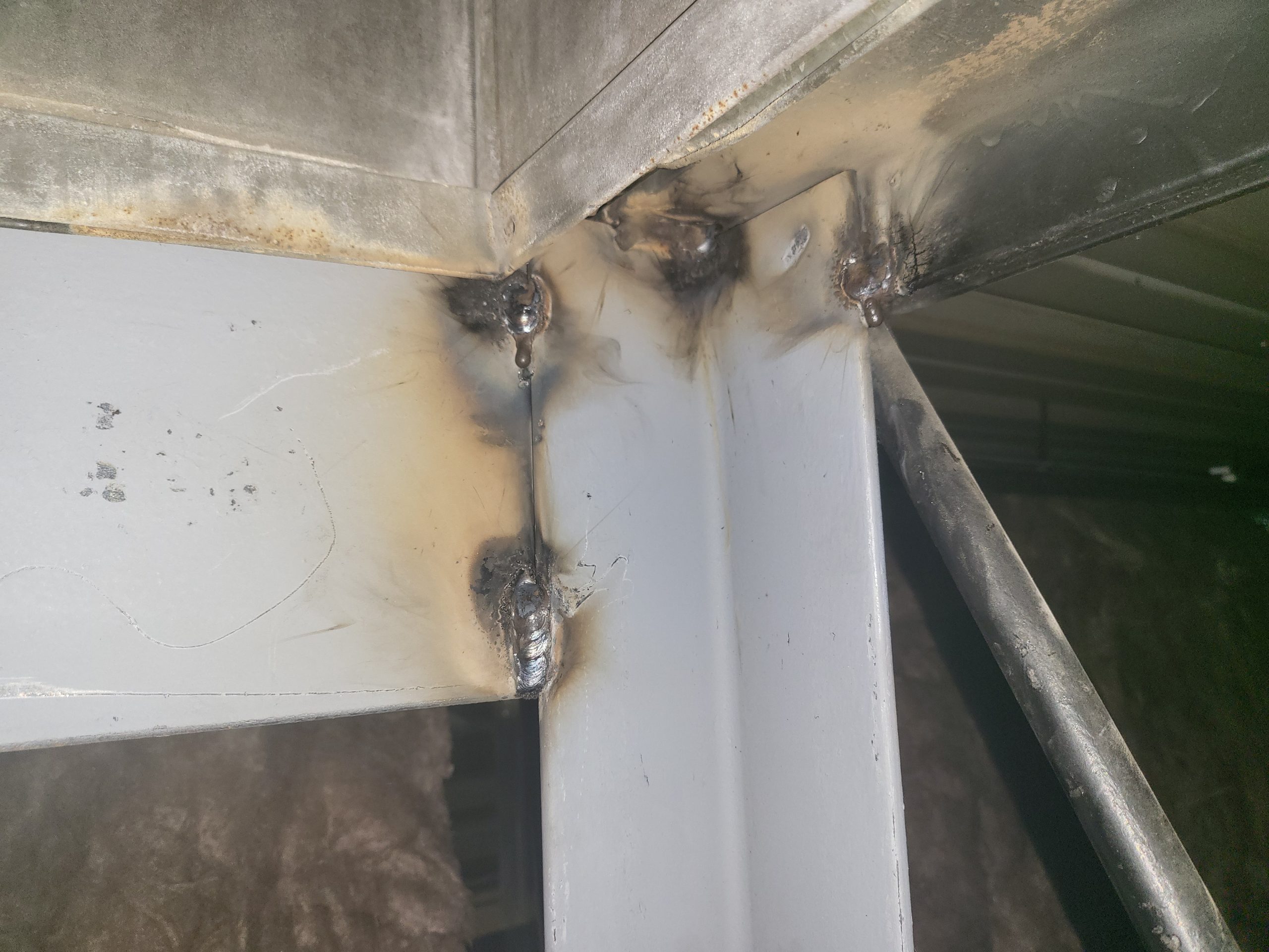 Third party welding inspector reviewing structural steel